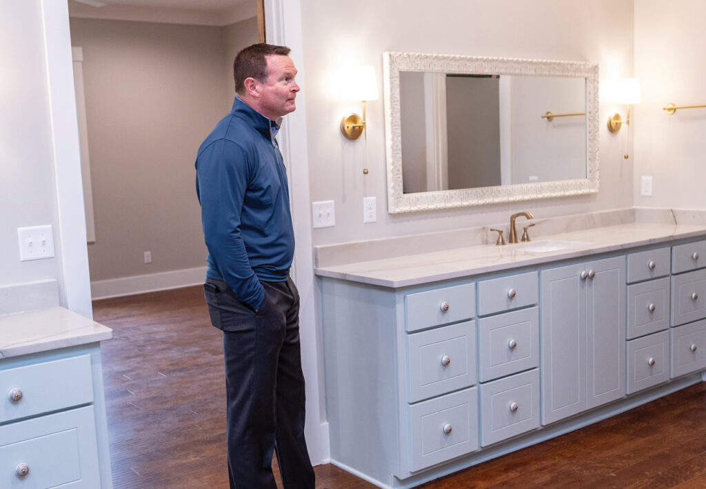 Man evaluating value of house