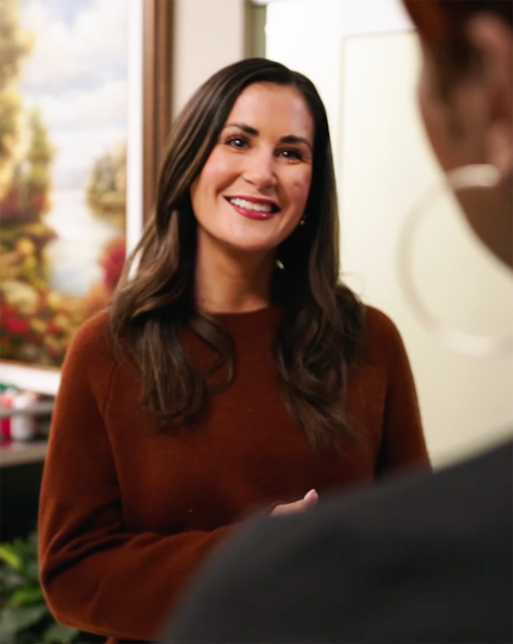 Bankers smiling in front of client