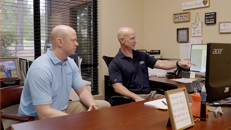Ward Mechanical members in the office discussing
