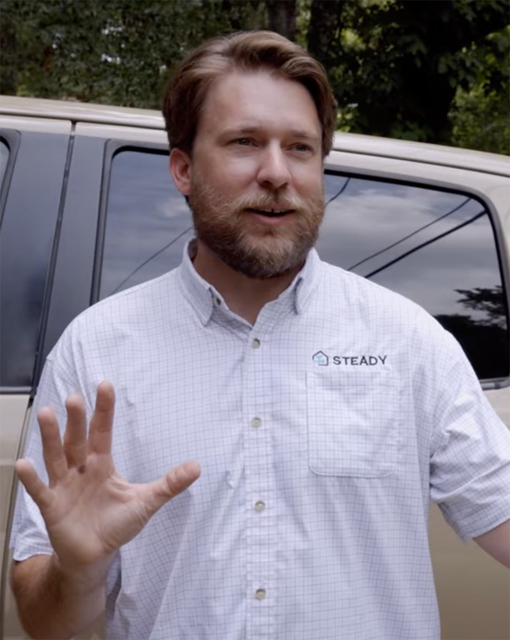Steady Home Maintenance founder discusses home care services with a client outdoors